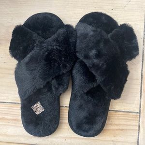 Black fuzzy slippers.